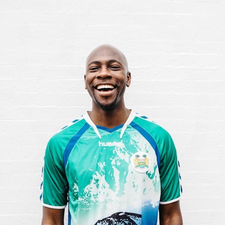 Alex Chen, Lead Design Curator at River Garden Muse, reviewing corporate floral arrangements